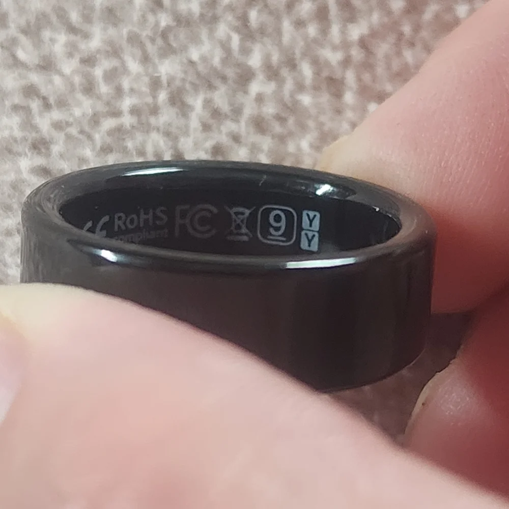 Sleek Black Smart Ring with Charging Case